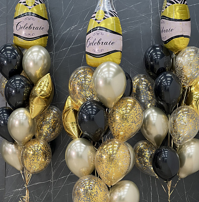 Фонтаны из золотых и черных шаров с шампанским
